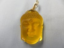 Mặt Phật Tổ đá màu vàng bọc bạc dài 4 rộng 2,6 cm